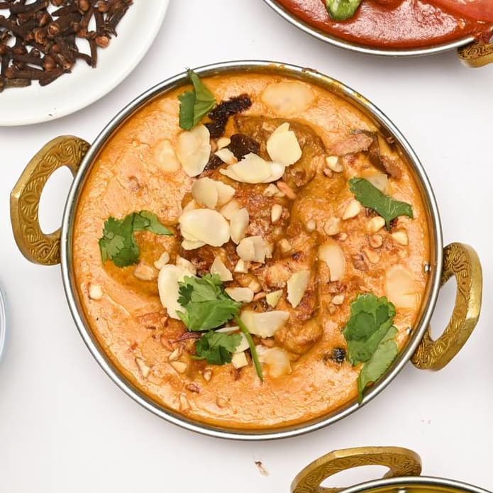 Rich korma topped with flaked almonds and fresh coriander